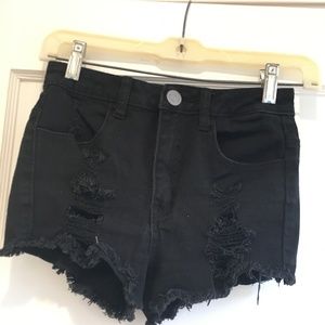 black ripped shorts